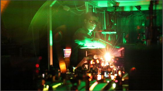UNM Research Assistant Aram Gragossian tests lasers in one of the Department of Physics & Astronomy's optics laboratories. Image courtesy of University New Mexico.